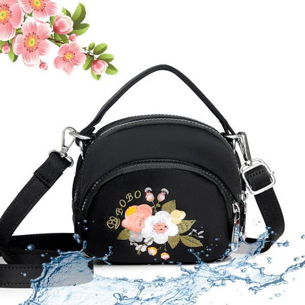 Small women's bag made of water-repellent fabric with flowers